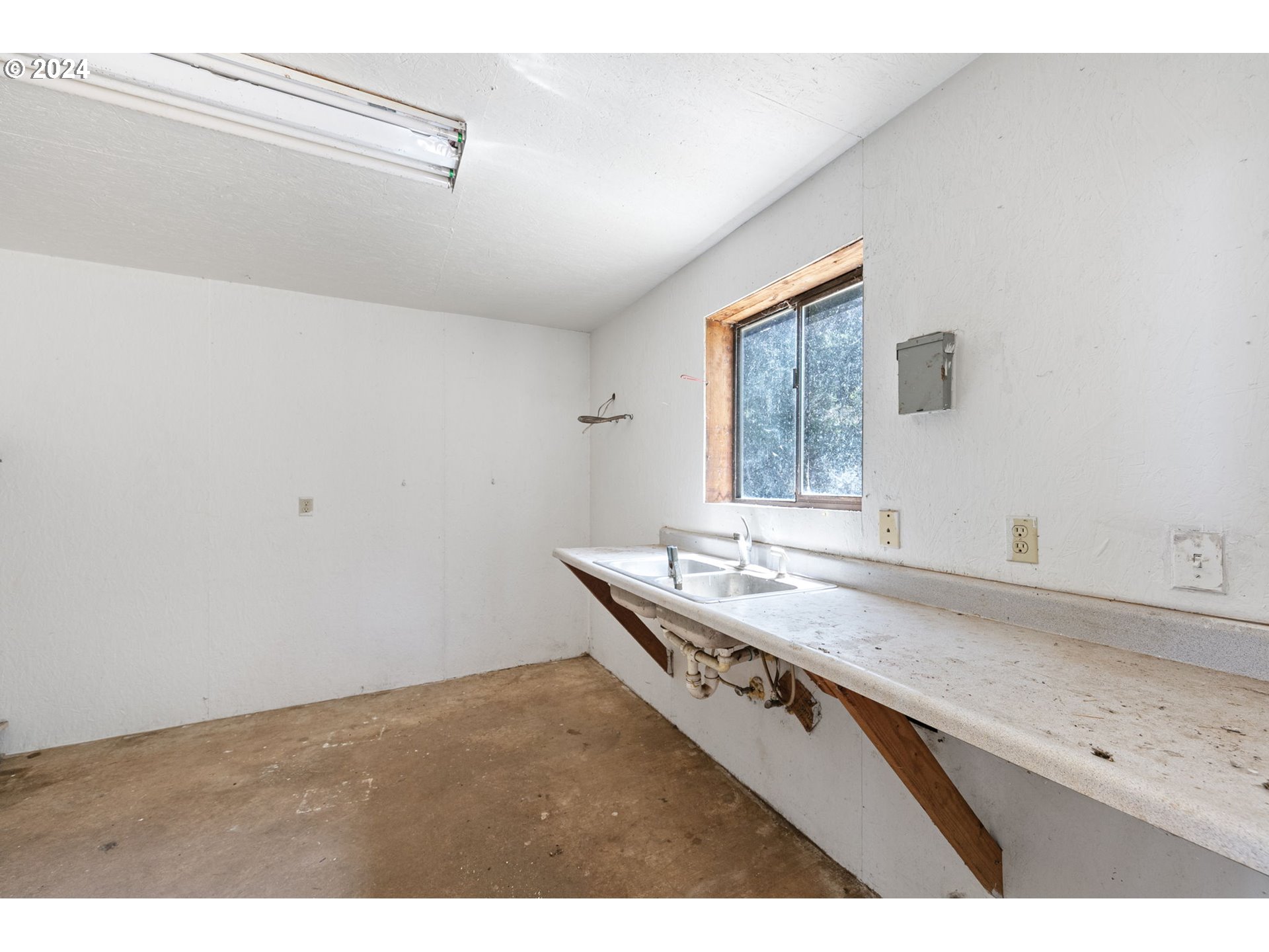 6551 Elkhead Road Yoncalla, OR 97499 - Photo 32 of 39 a bathroom with a granite countertop sink a mirror and a