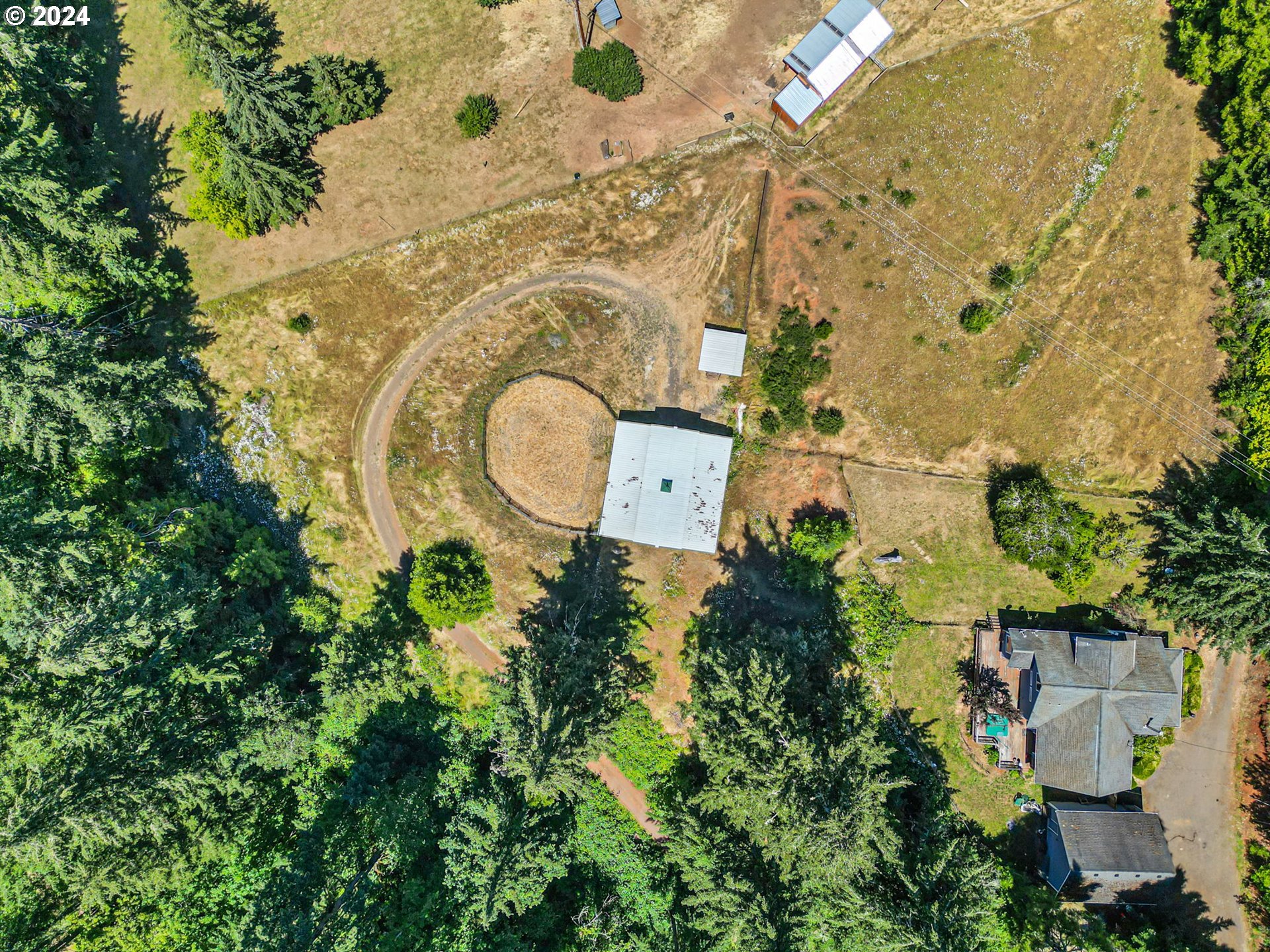6551 Elkhead Road Yoncalla, OR 97499 - Photo 35 of 39 an aerial view of a house with a yard swimming pool and outdoor seating