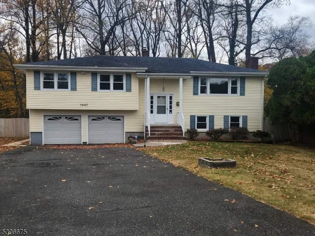 a view of a yard in front of a house