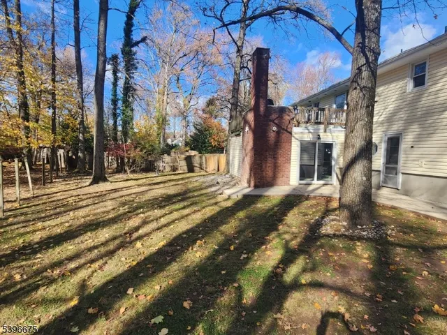 a view of a building with snow on the road