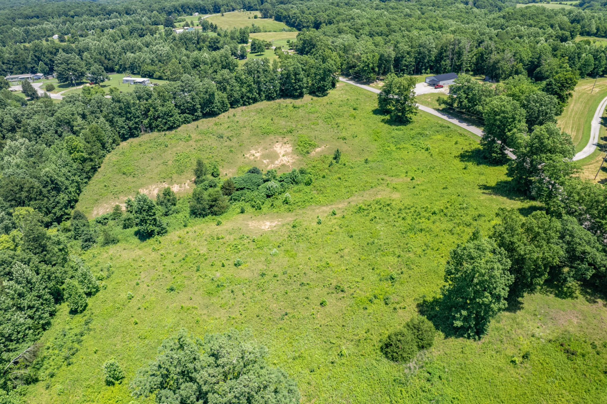 0 Mobley Ridge Road Duck River, TN 38454 - Photo 12 of 35 a view of a garden with a building