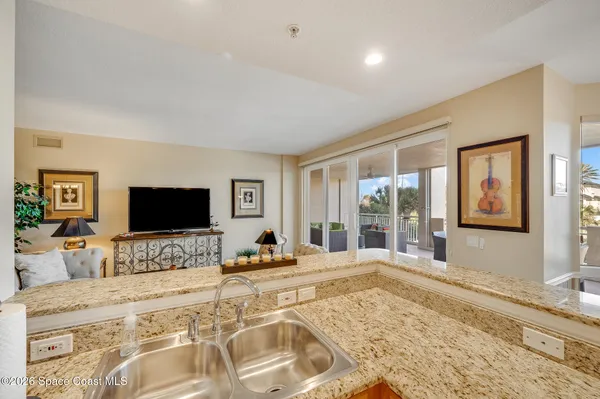 a living room with furniture fireplace and a chandelier