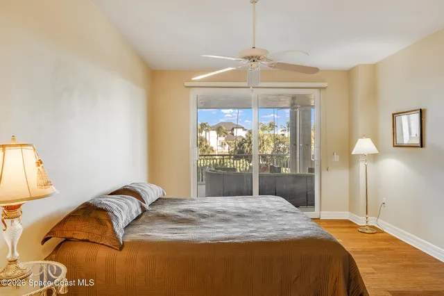 a bathroom with a granite countertop sink mirror and a toilet