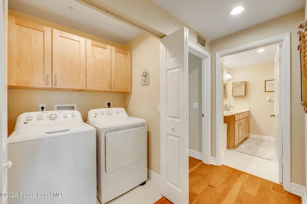 a living room with furniture and a dresser