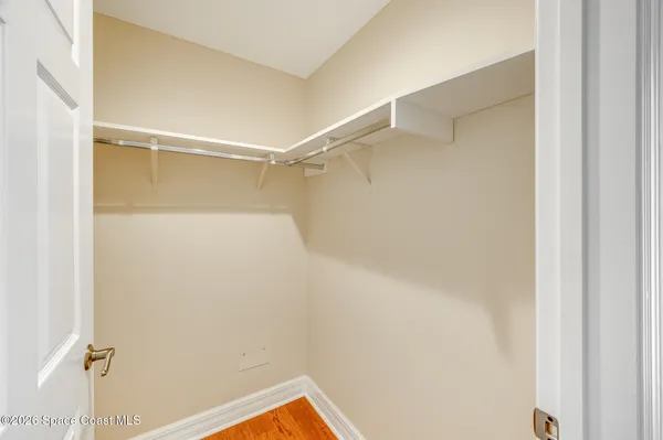 a dining room with furniture and a floor to ceiling window