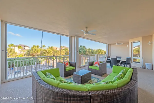 a view of a room with furniture and a window