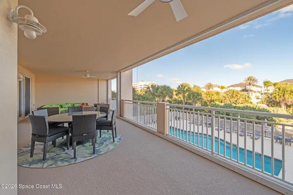 a view of a backyard with plants and lake view