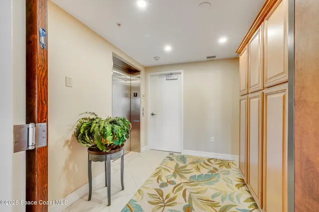 a view of a livingroom with a furniture wooden floor and bedroom