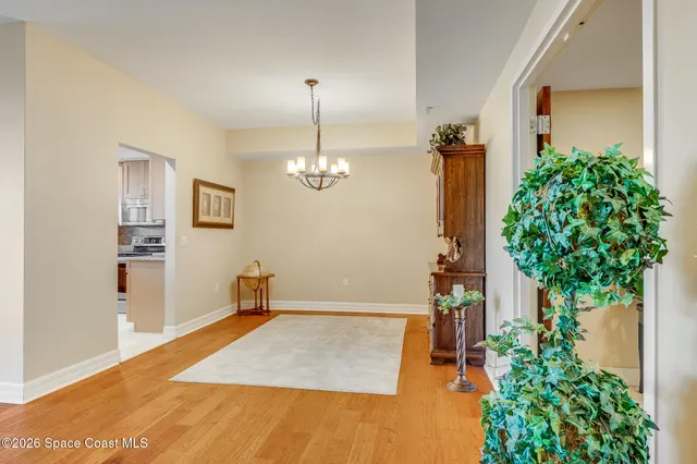 a view of a livingroom with a dinning table and couches chair