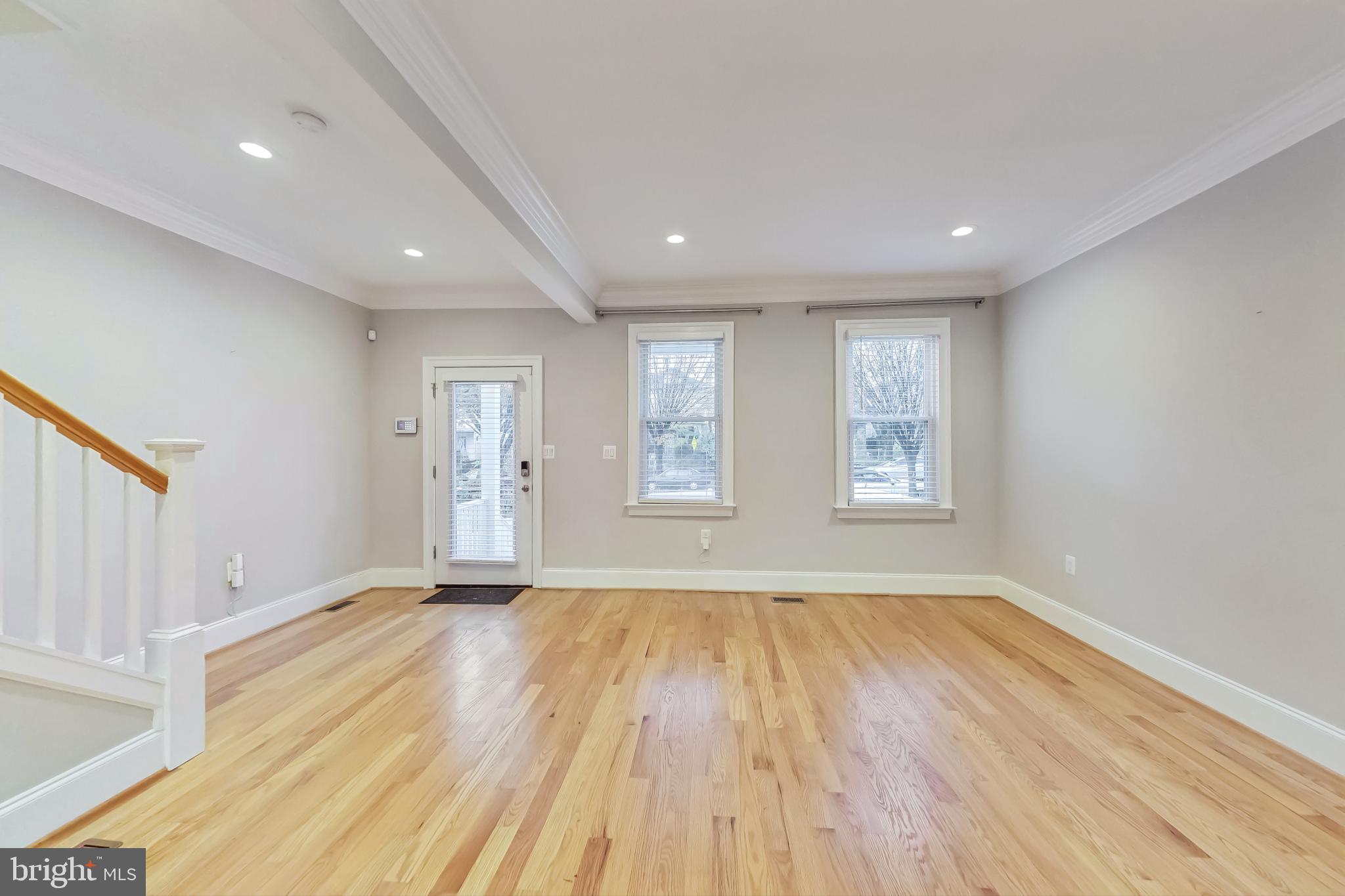 5415 Illinois Avenue Northwest Washington, DC 20011 - Photo 11 of 44 a view of an empty room with wooden floor and a window