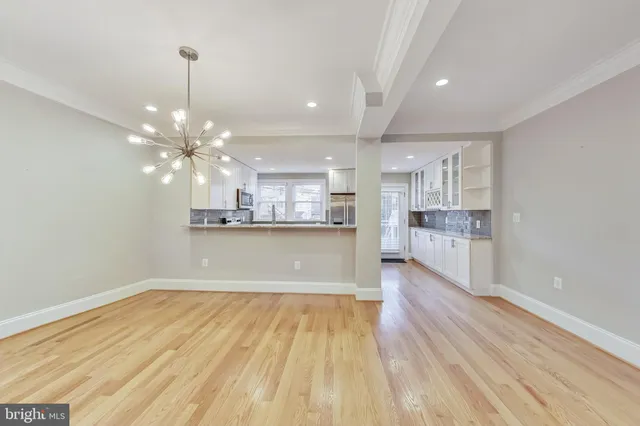 a view of kitchen and kitchen with wooden floor