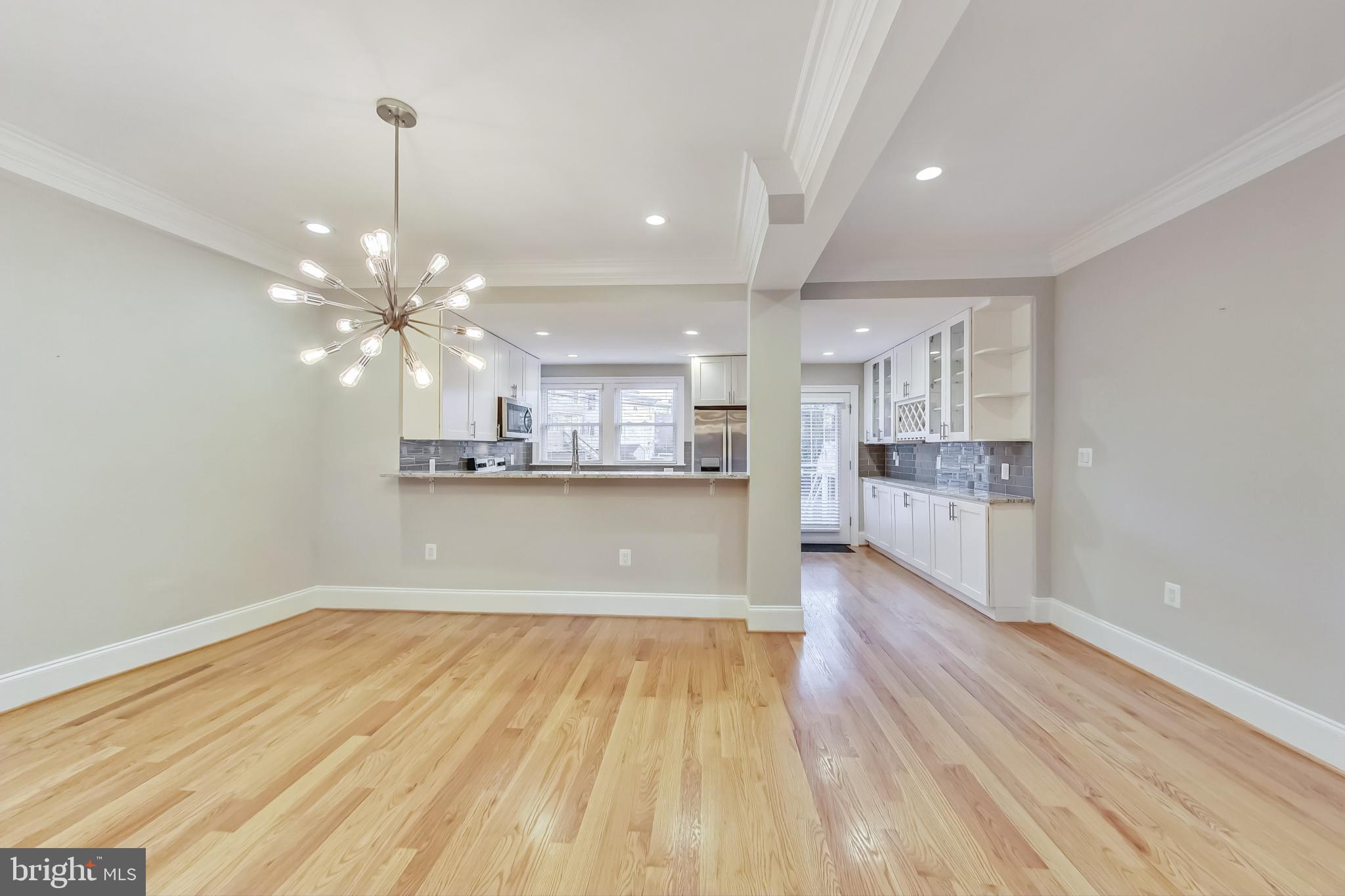 5415 Illinois Avenue Northwest Washington, DC 20011 - Photo 12 of 44 a view of kitchen and kitchen with wooden floor