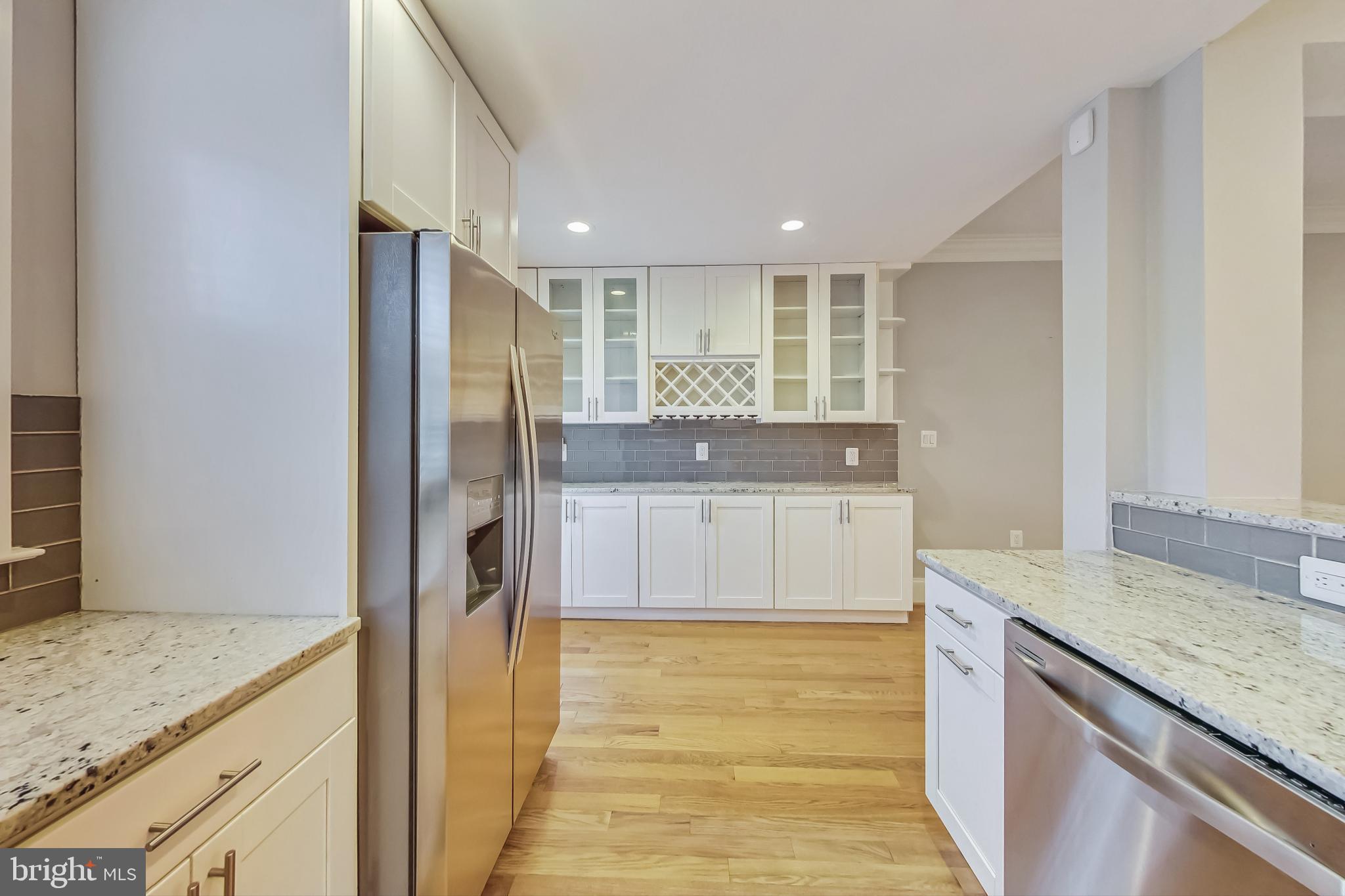 5415 Illinois Avenue Northwest Washington, DC 20011 - Photo 17 of 44 a bathroom with a granite countertop sink a mirror and a shower