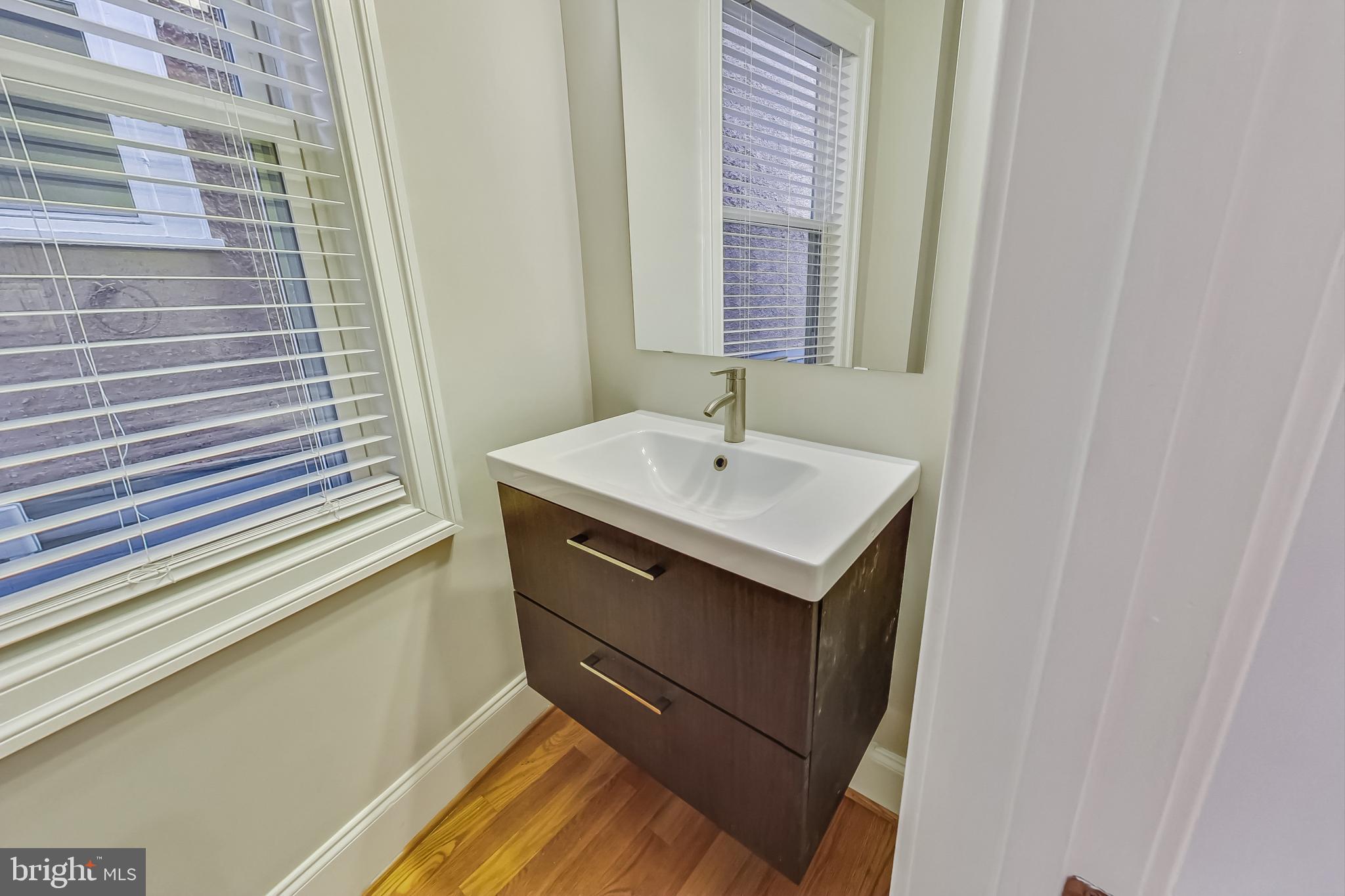 5415 Illinois Avenue Northwest Washington, DC 20011 - Photo 18 of 44 a bathroom with a sink and a mirror