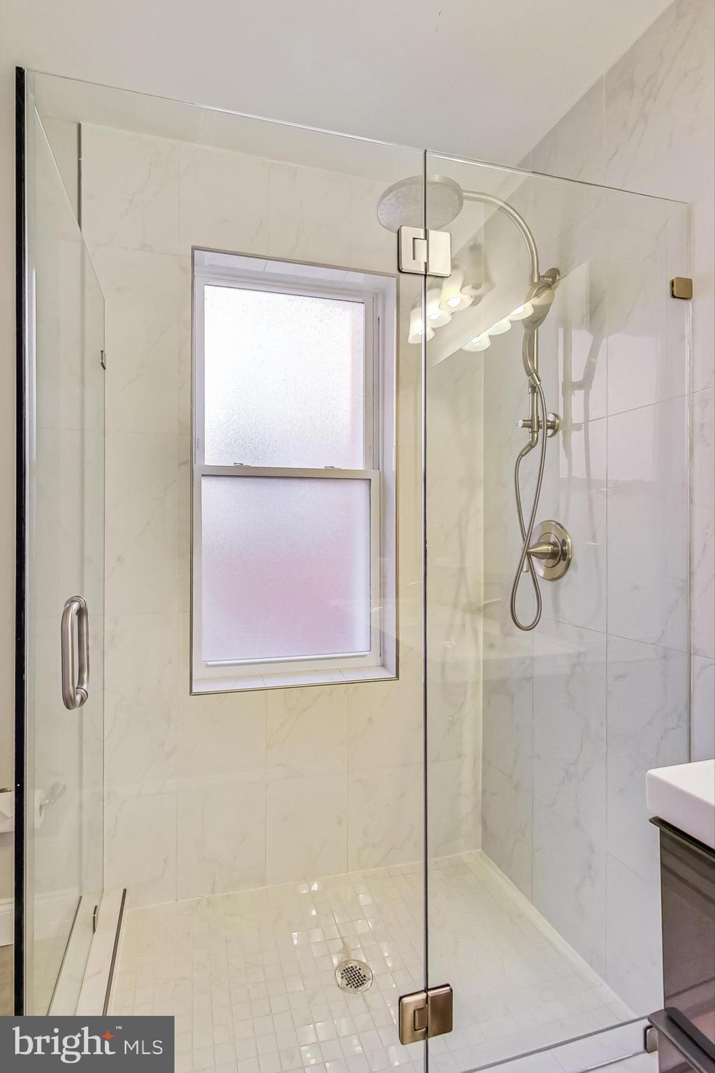 5415 Illinois Avenue Northwest Washington, DC 20011 - Photo 23 of 44 a bathroom with a glass shower door