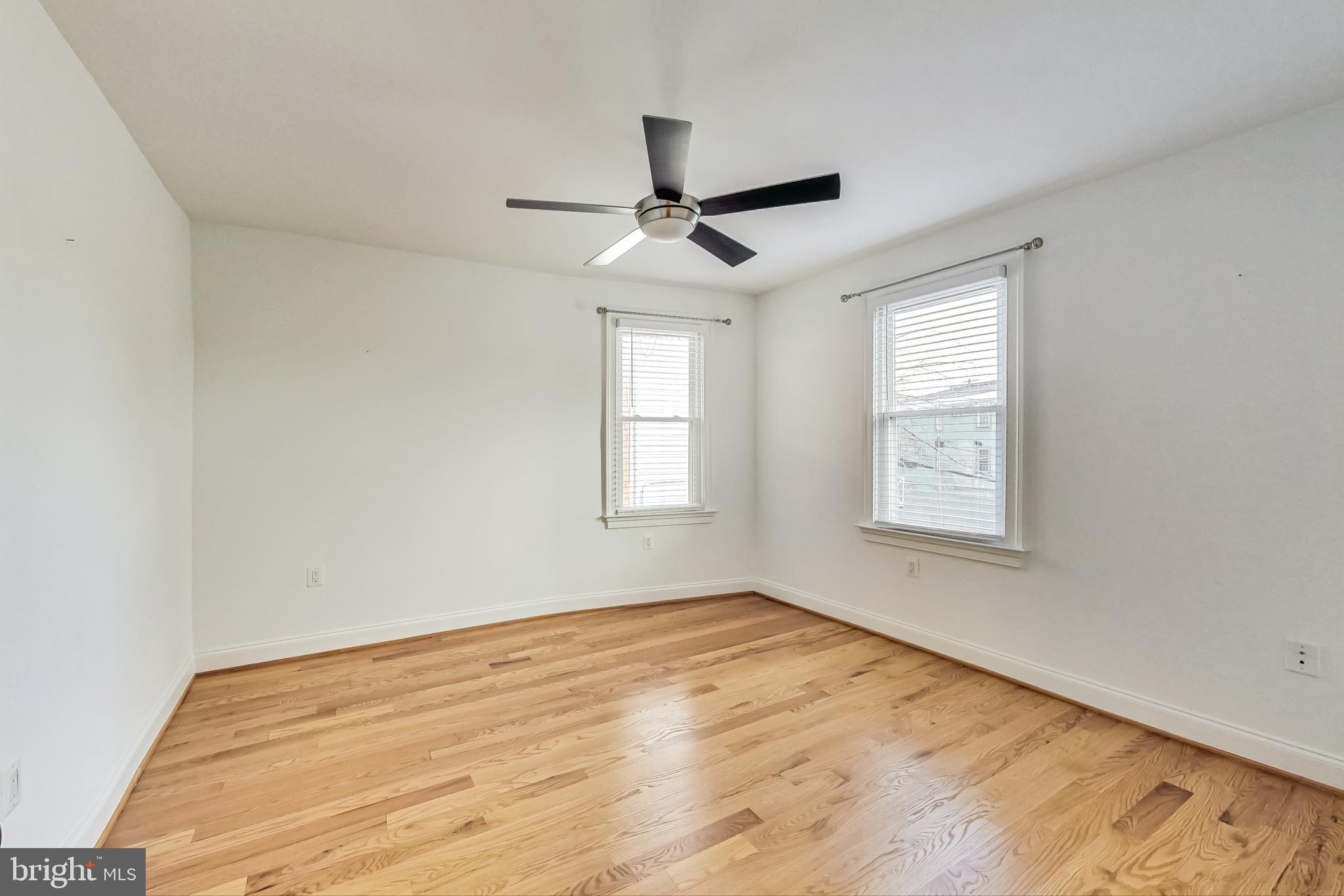 5415 Illinois Avenue Northwest Washington, DC 20011 - Photo 24 of 44 a view of empty room with wooden floor and fan