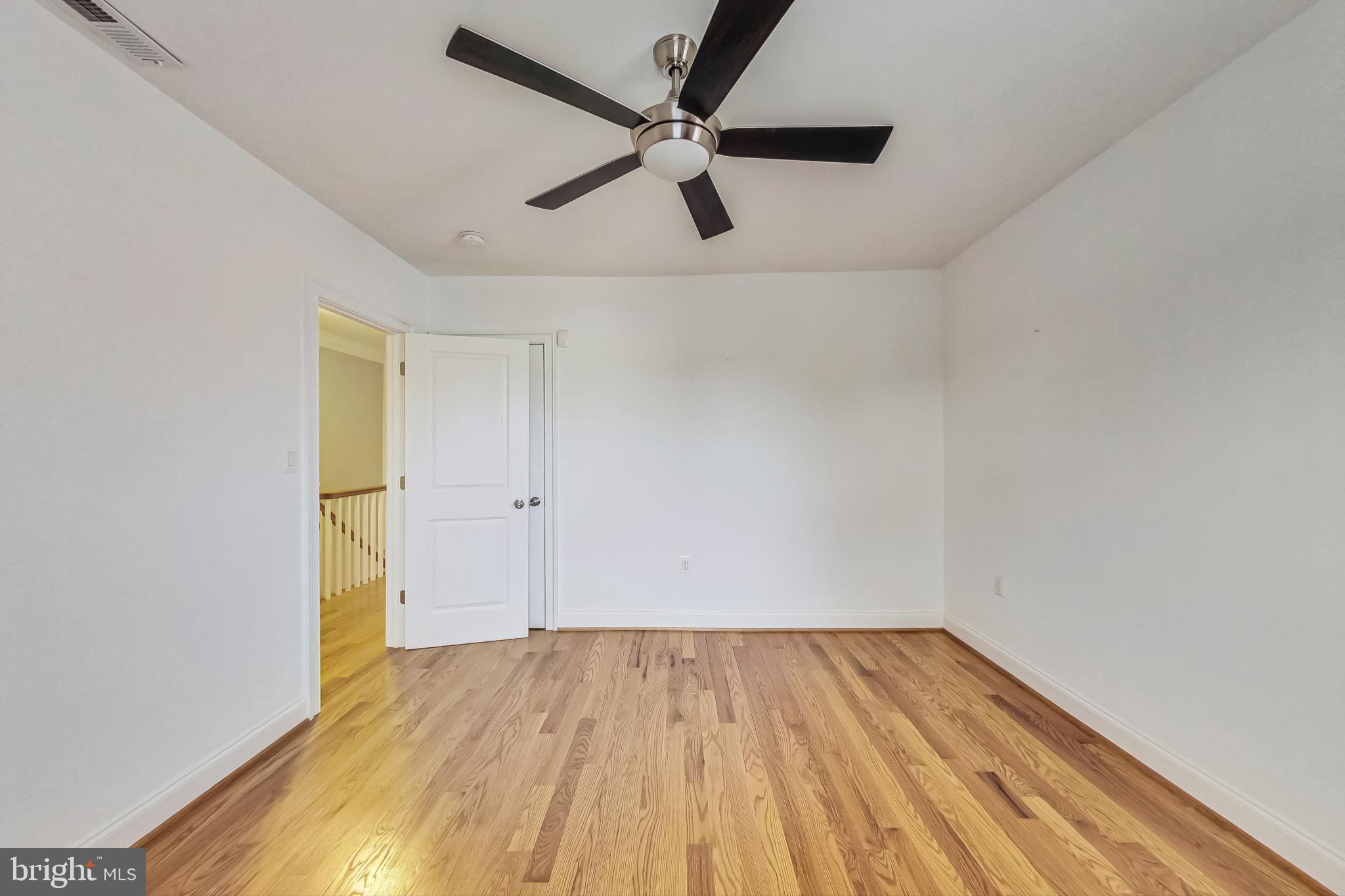 5415 Illinois Avenue Northwest Washington, DC 20011 - Photo 26 of 44 a view of empty room with wooden floor