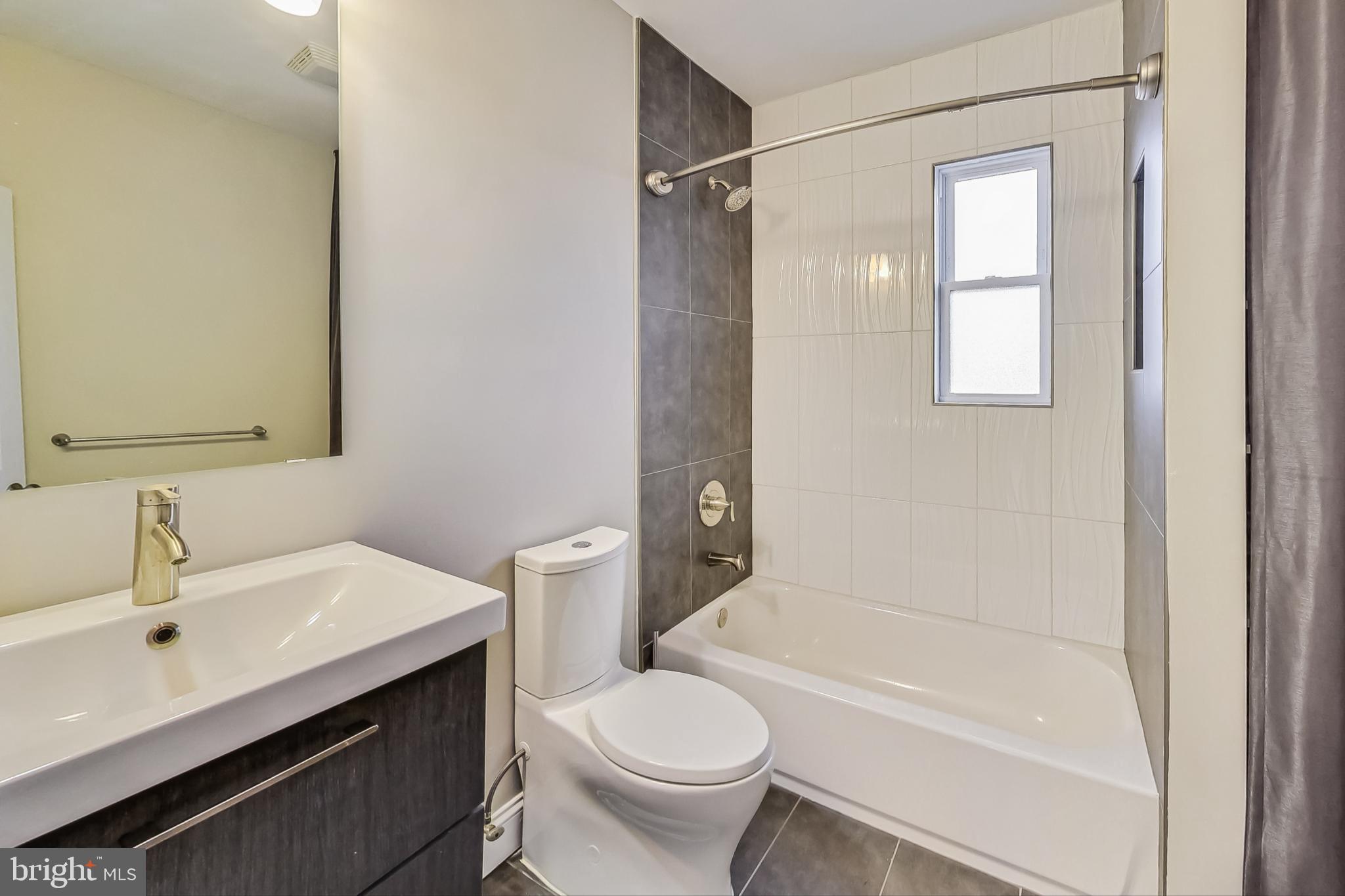 5415 Illinois Avenue Northwest Washington, DC 20011 - Photo 27 of 44 a bathroom with a sink toilet and shower