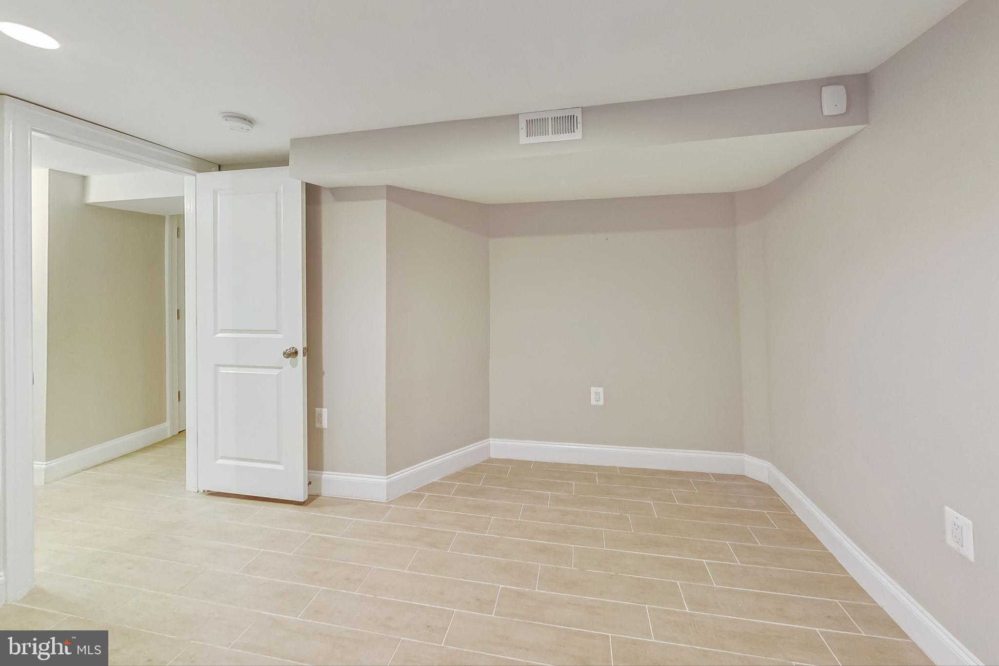 5415 Illinois Avenue Northwest Washington, DC 20011 - Photo 34 of 44 wooden floor in an empty room