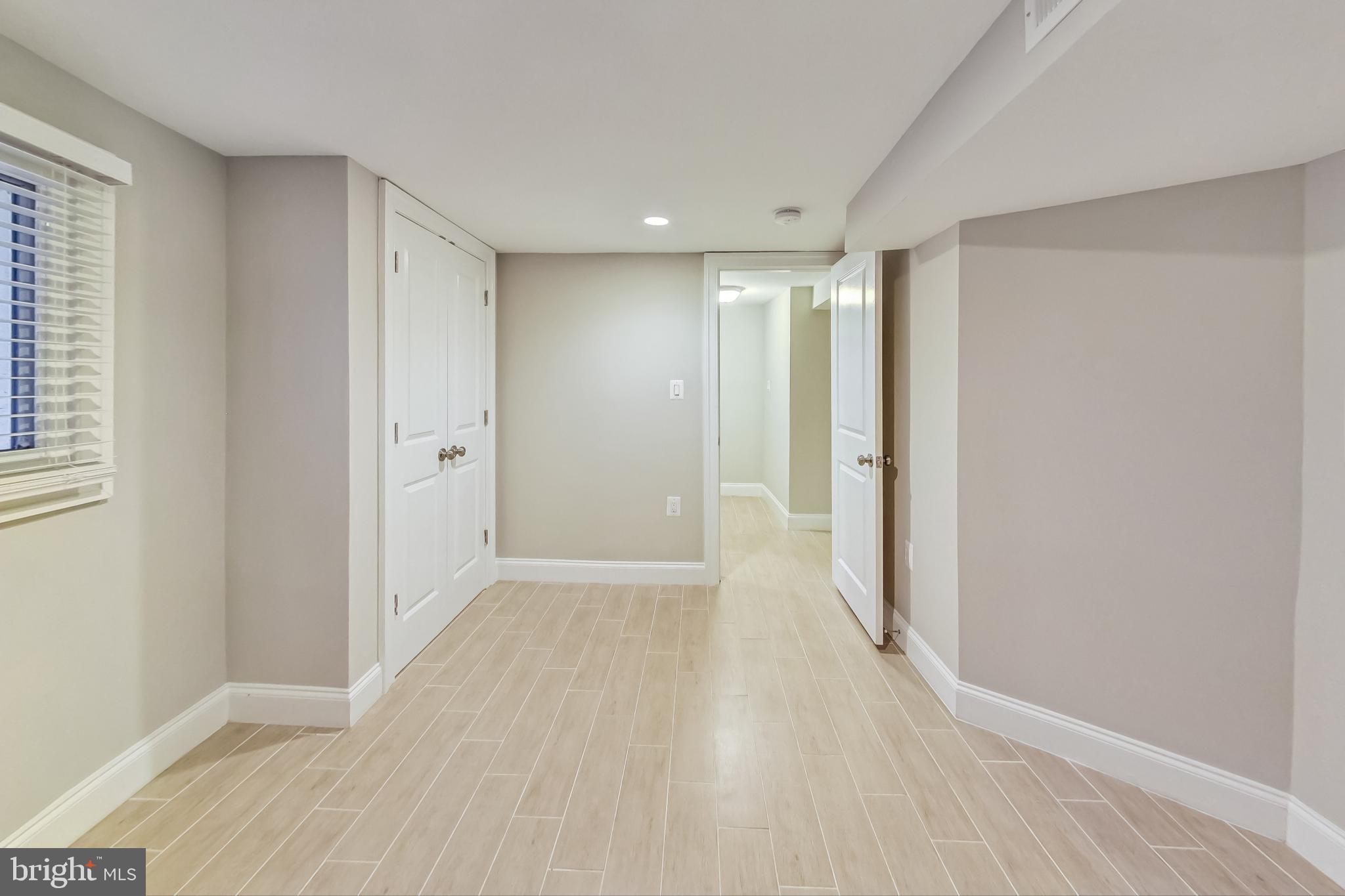 5415 Illinois Avenue Northwest Washington, DC 20011 - Photo 35 of 44 wooden floor in an empty room with a window