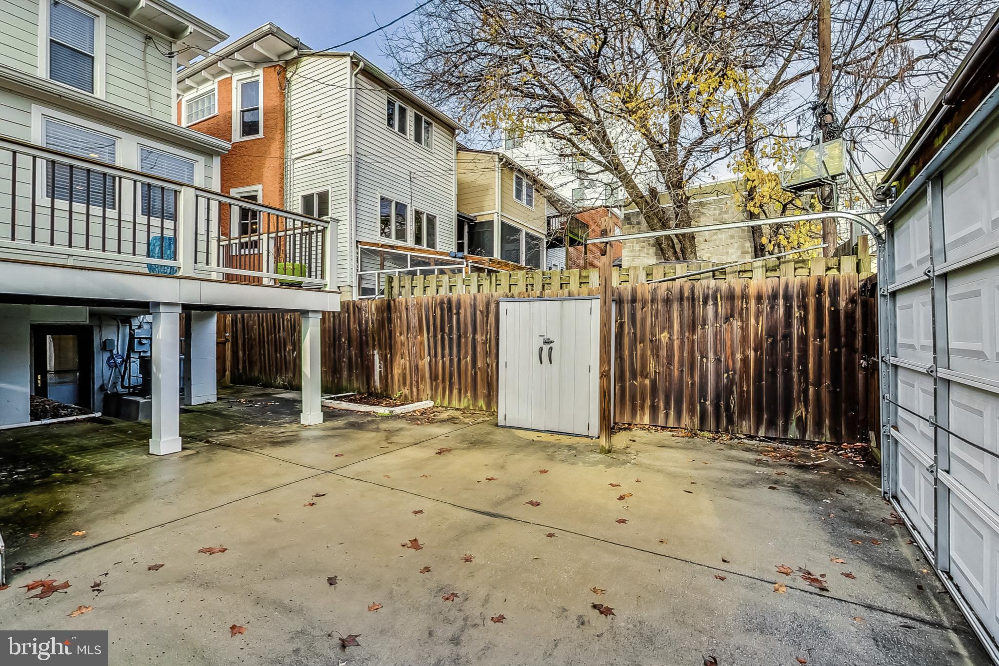 5415 Illinois Avenue Northwest Washington, DC 20011 - Photo 43 of 44 a view of a brick house with large windows and a small yard