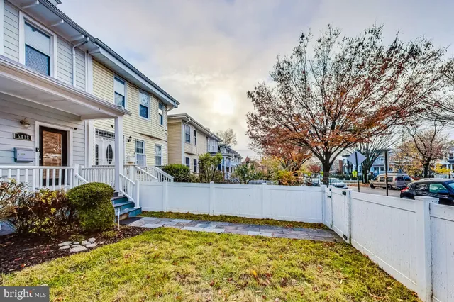 a view of backyard with large trees