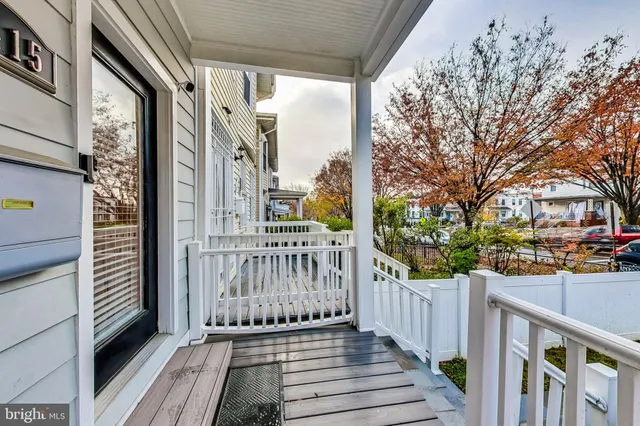 a view of a balcony with wooden floor