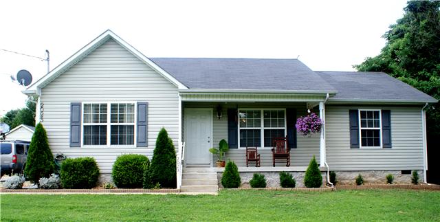 2023 Clara Mathis Road Spring Hill, TN 37174 - Photo 1 of 16 a front view of a house with a yard and porch