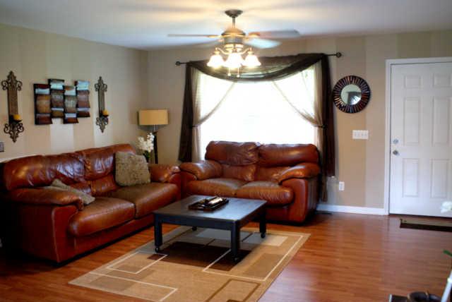 2023 Clara Mathis Road Spring Hill, TN 37174 - Photo 4 of 16 a living room with furniture a window and a chandelier