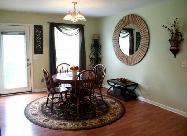 2023 Clara Mathis Road Spring Hill, TN 37174 - Photo 5 of 16 a view of a dining room with furniture and chandelier