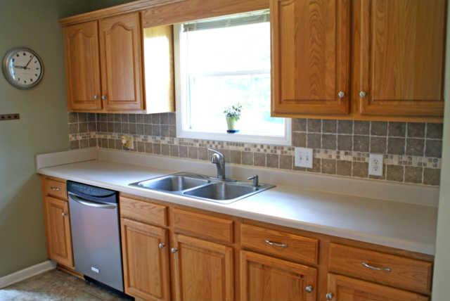 2023 Clara Mathis Road Spring Hill, TN 37174 - Photo 6 of 16 a kitchen with a sink and cabinets