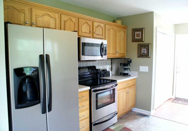 2023 Clara Mathis Road Spring Hill, TN 37174 - Photo 7 of 16 a kitchen with a refrigerator and a stove top oven