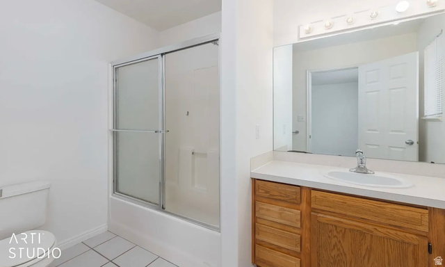 4823 Old Post Road Ogden, UT 84403 - Photo 19 of 19 Wood-finish vanity with an integrated sink and chrome faucet