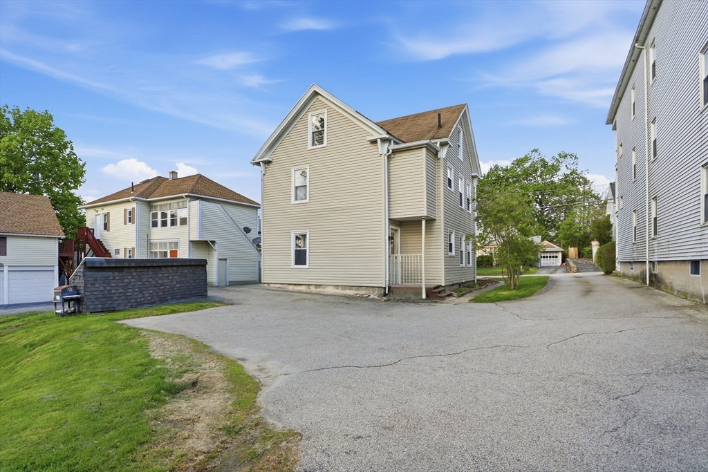 12 Whitcomb Street Webster, MA 01570 - Photo 38 of 40 a front view of a house with a yard and garage