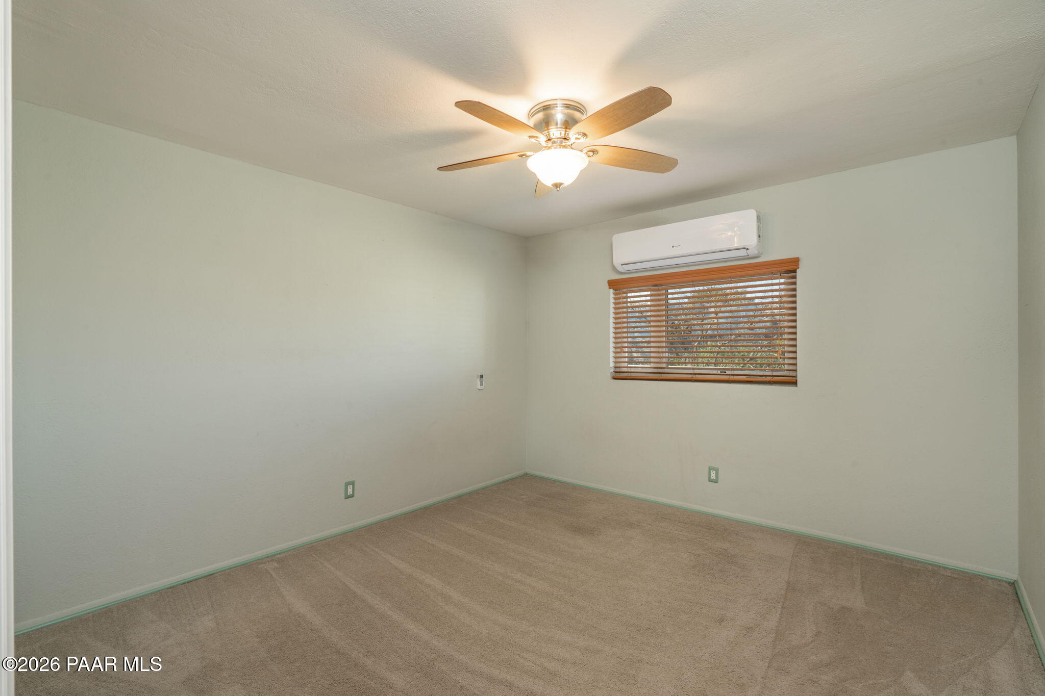 17270 East Peach Tree Road Mayer, AZ 86333 - Photo 16 of 31 an empty room with a fan & a window