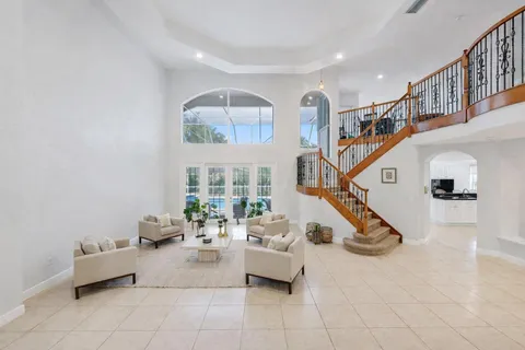 a living room with furniture and white walls