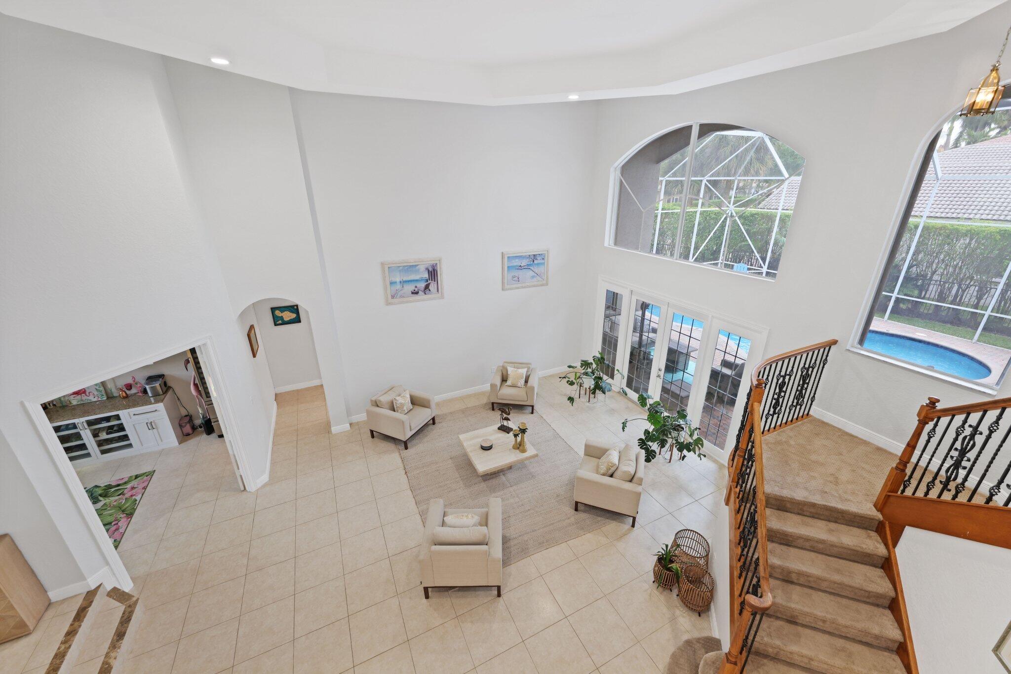 19219 North Creekshore Court Boca Raton, FL 33498 - Photo 49 of 73 a living room with furniture and a window