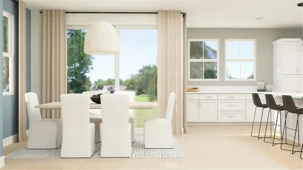 a living room with a large window and table