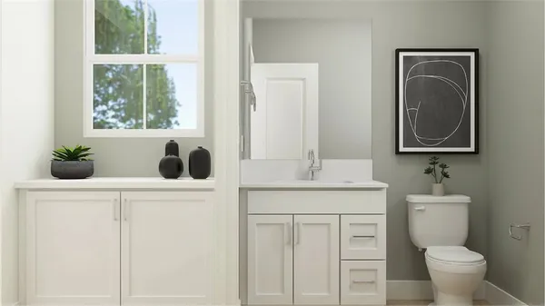 a bathroom with a toilet a sink a window and mirror