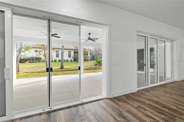 a view of a livingroom with a ceiling fan and window