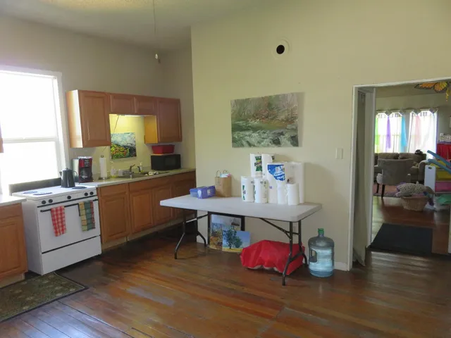 a bedroom with furniture and a window