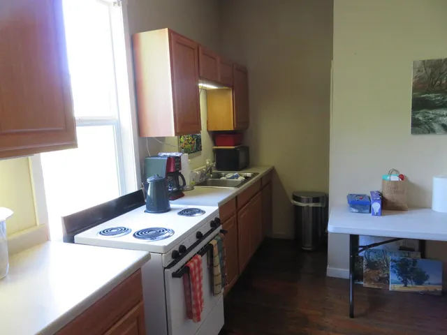 a kitchen with a sink and a stove top oven