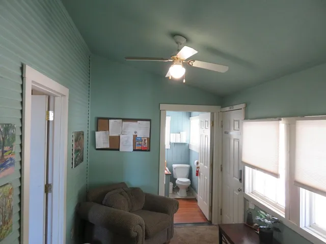 a bedroom with furniture and a window