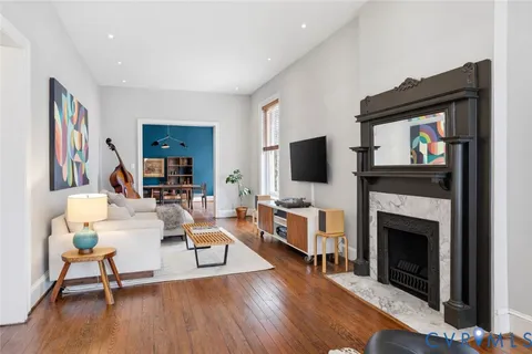 a spacious bedroom with a bed and a large window