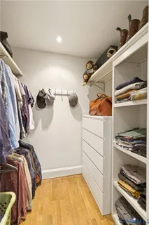 a view of a patio with couches table and chairs and potted plants