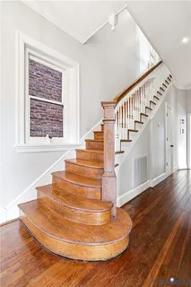 a view of a workspace with furniture and a potted plant