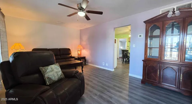 a living room with furniture and a window