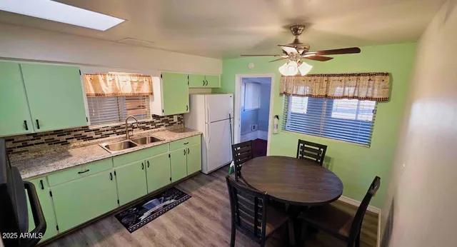 a kitchen with a table and chairs
