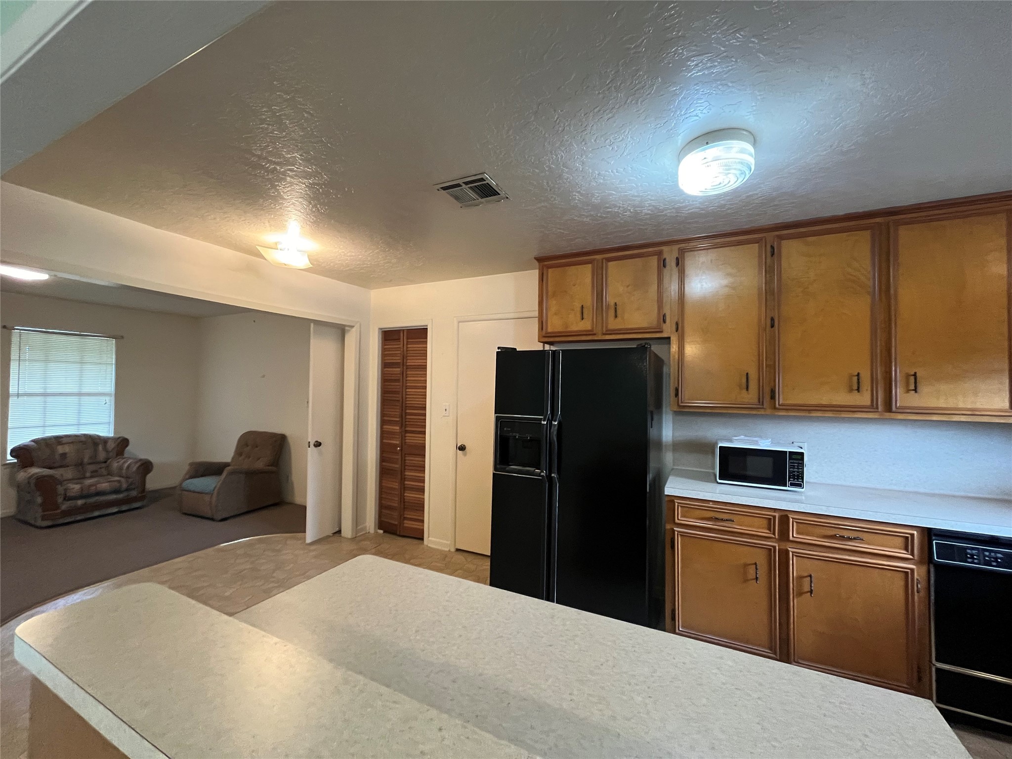 1475 Cr 16 Road Garwood, TX 77442 - Photo 19 of 43 a kitchen with a refrigerator and a sink