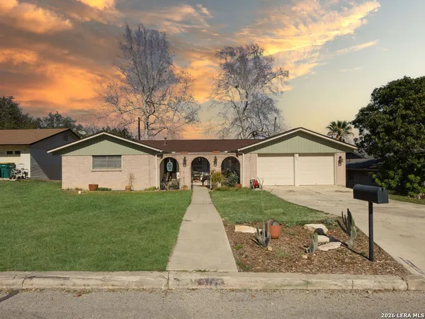 a front view of a house with yard